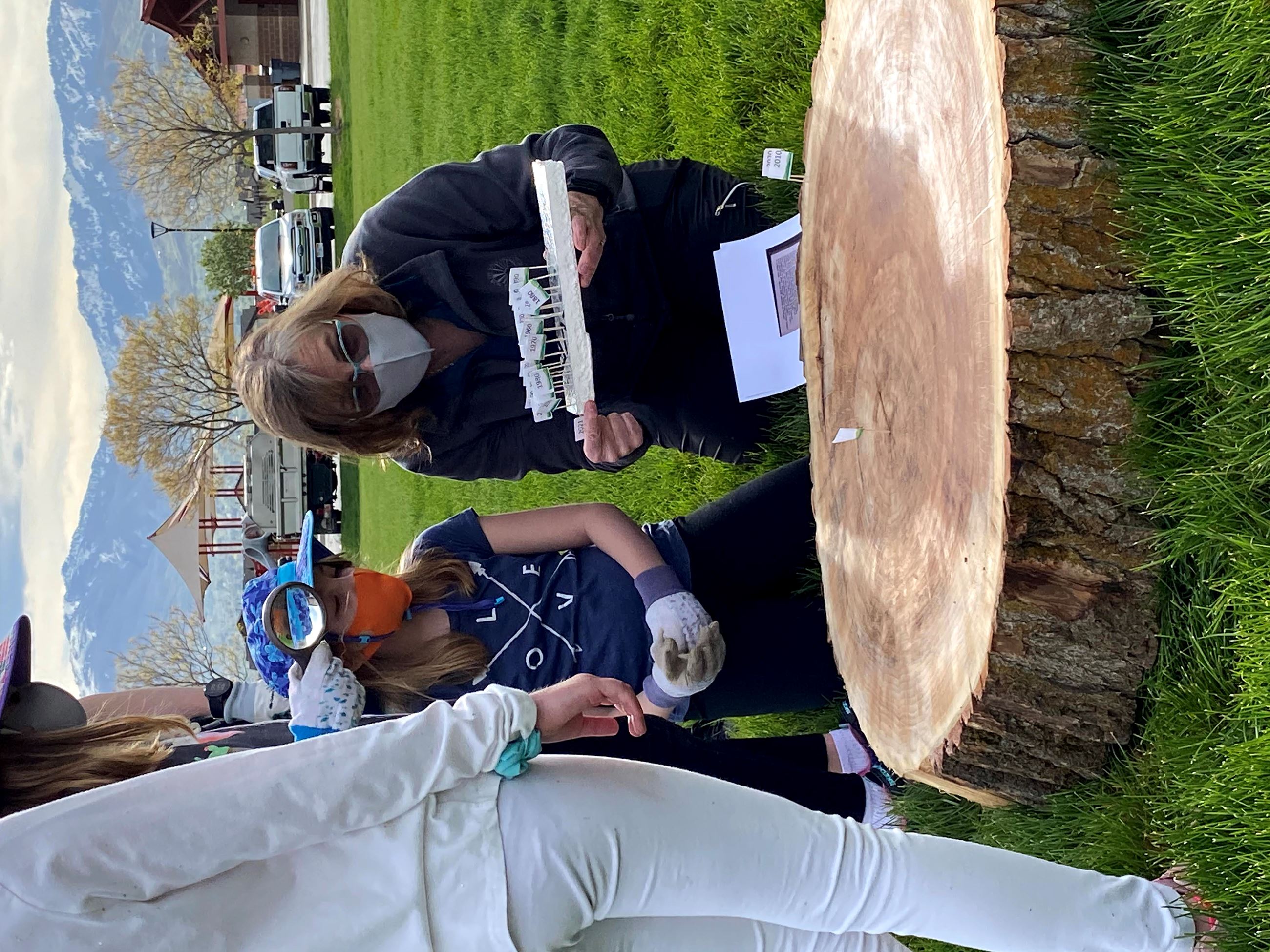 IMG_6925 Lisa on knees by tree slice girl blue hat